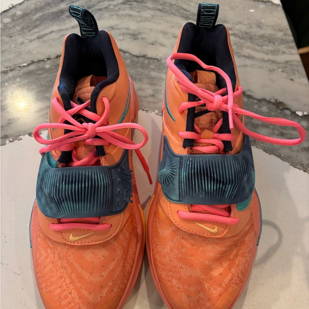 Nike Greek Freak Orange and Teal women’s basketball shoes